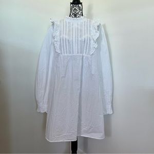 ASOS Design lightweight cotton dress with ruffle bib top and accent sleeves.